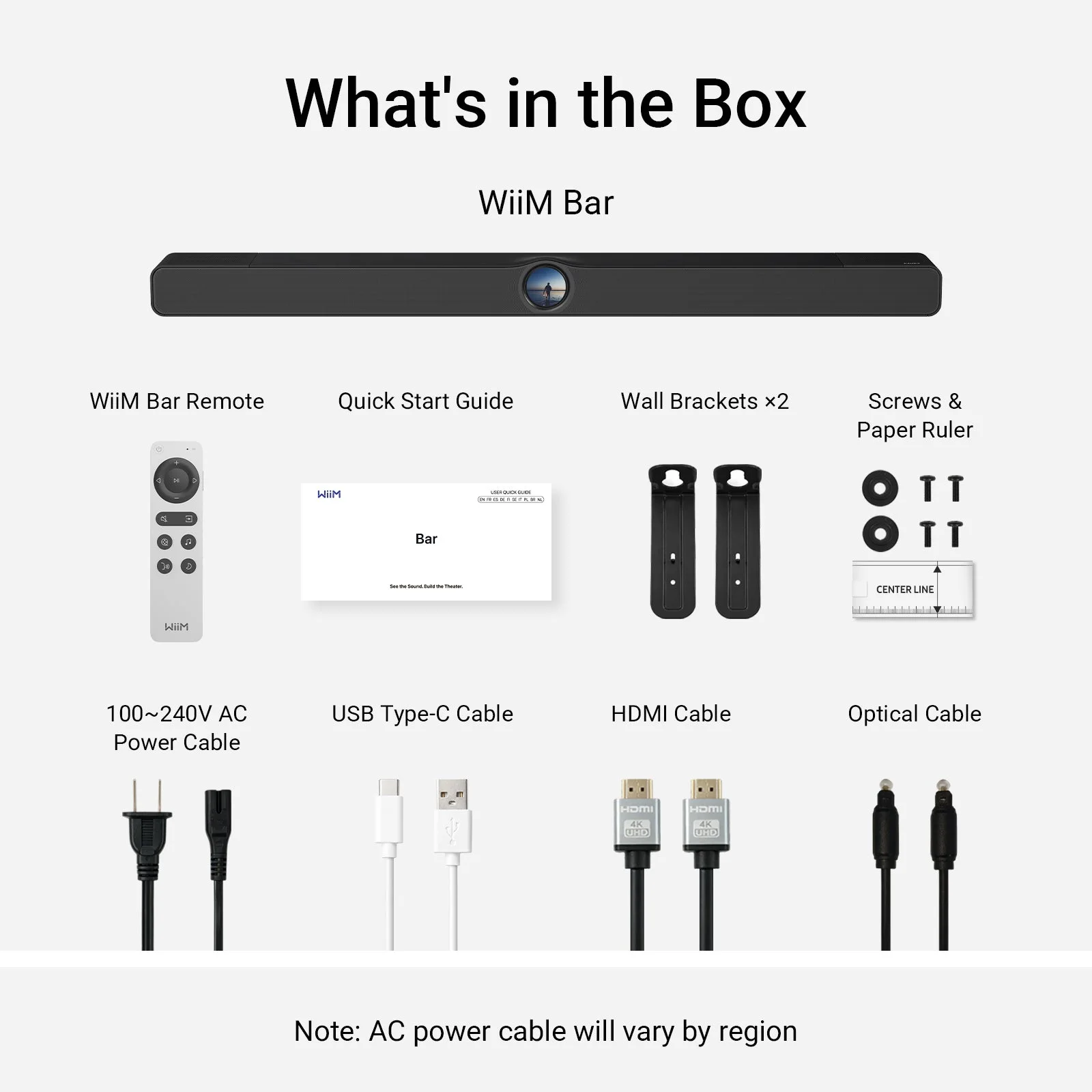 Contenu de la boîte de la WiiM Bar : télécommande, câbles et supports muraux